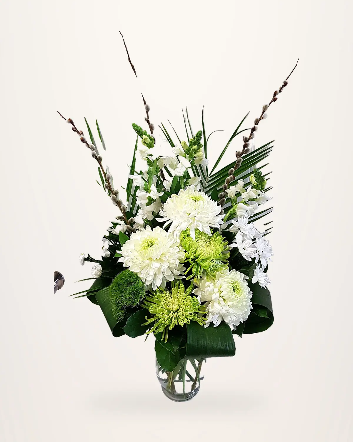 White chrysanthemum arrangement in a glass vase